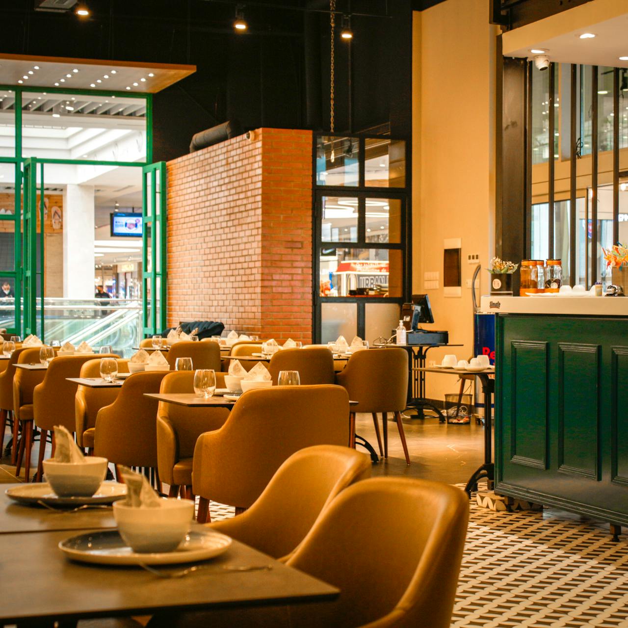 contact-img A stylish café interior showcasing contemporary design and elegant seating arrangements.